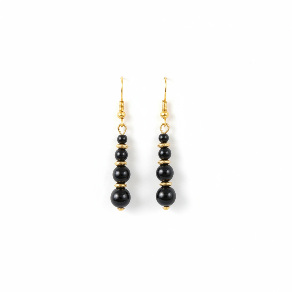 Boucles perles noir et or fond blanc